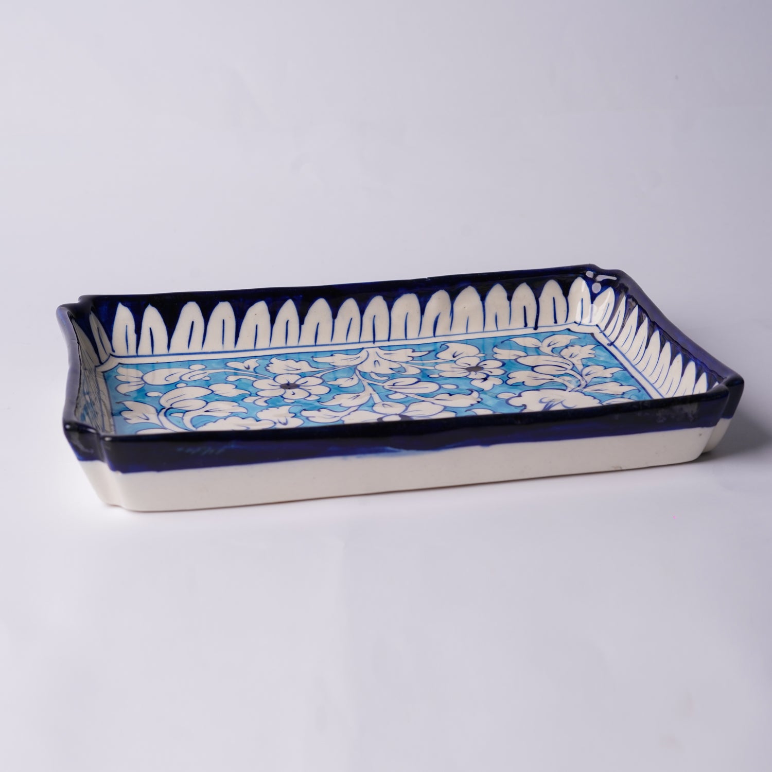 Floral design blue pottery tray overhead view — handmade ceramic — Craftan Pakistan