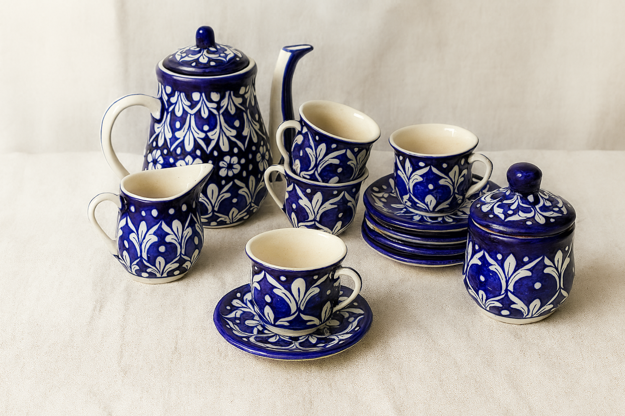 Blue and white ceramic tea set on a light background