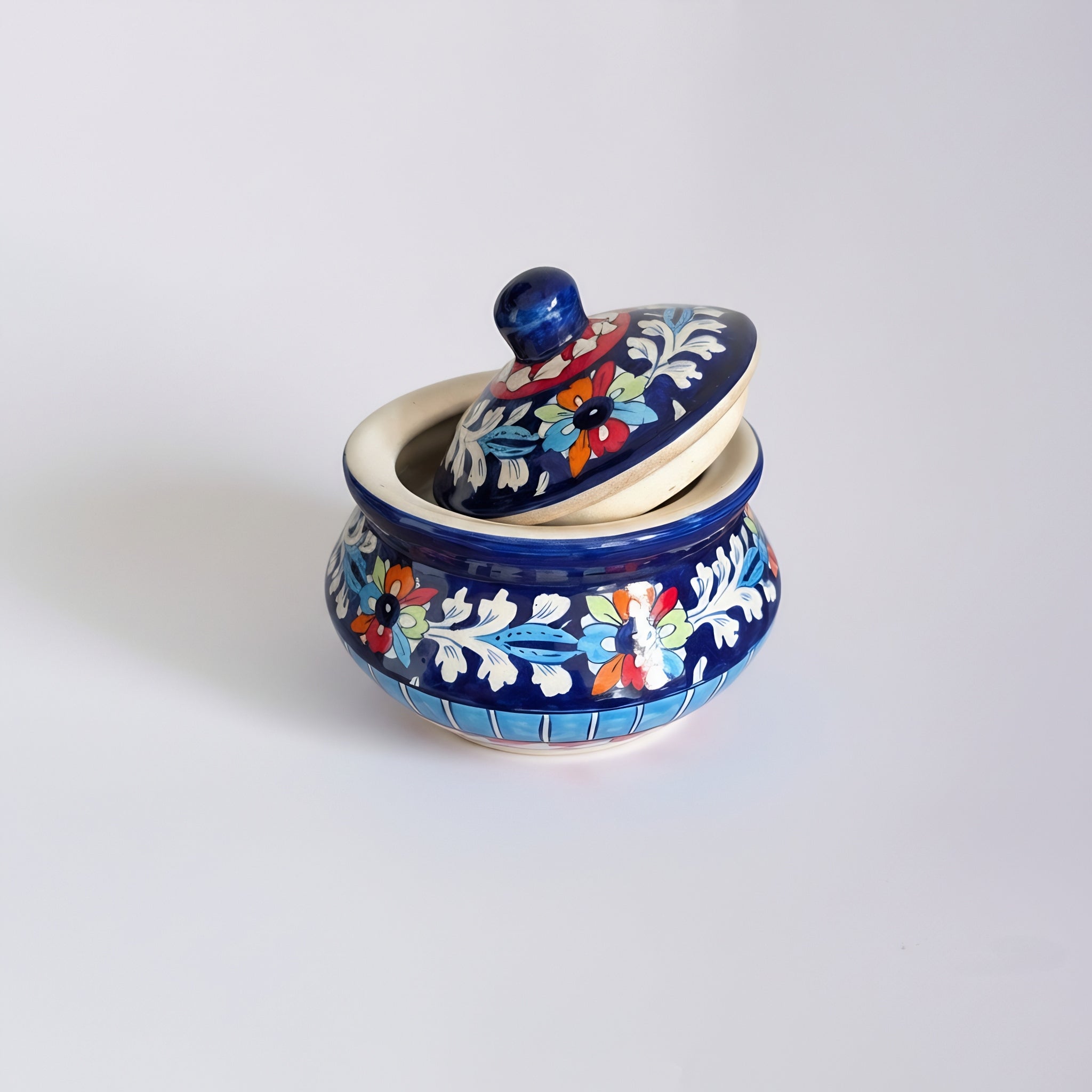 Blue pottery serving pot with colorful floral patterns — handmade ceramic — Craftan Pakistan