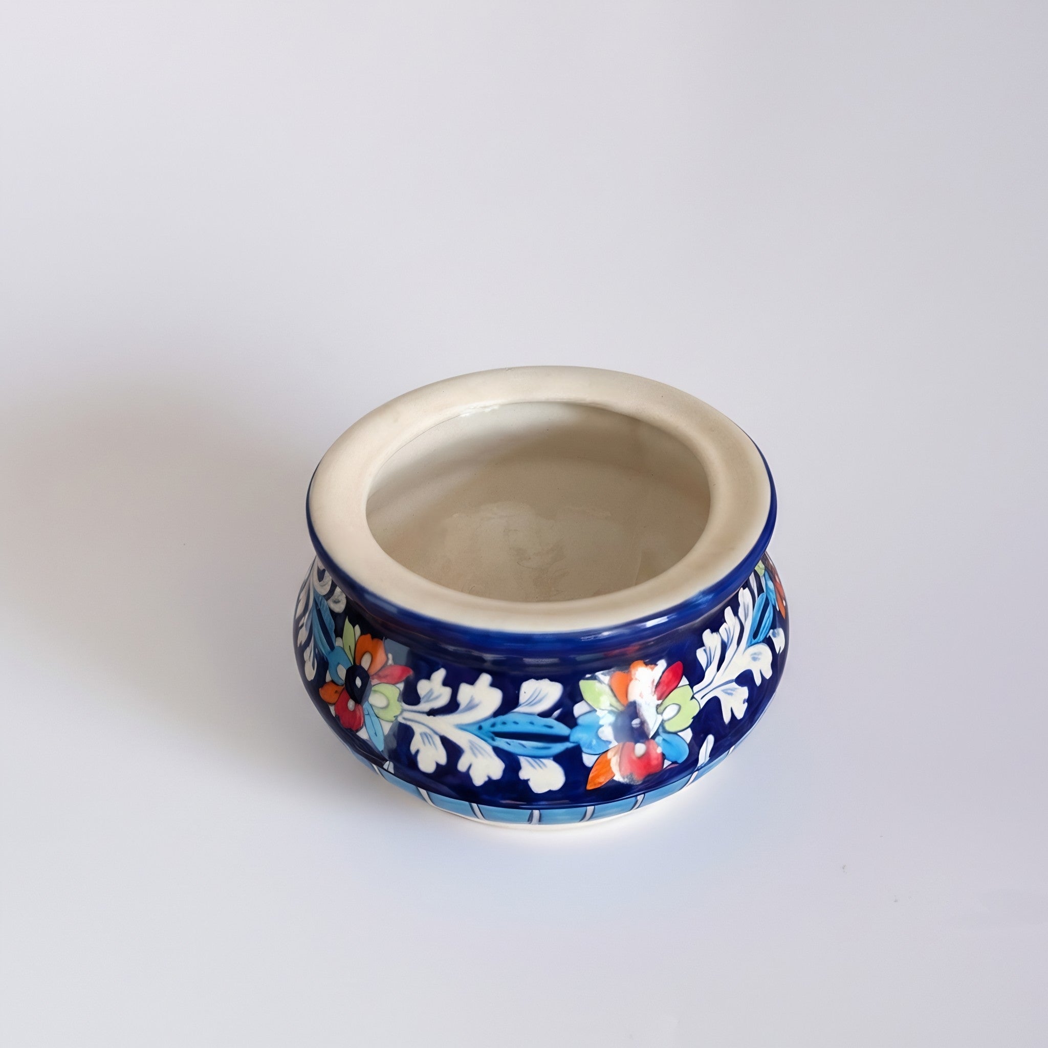 Pakistani handmade ceramic serving pot featuring vibrant floral designs — Craftan Pakistan