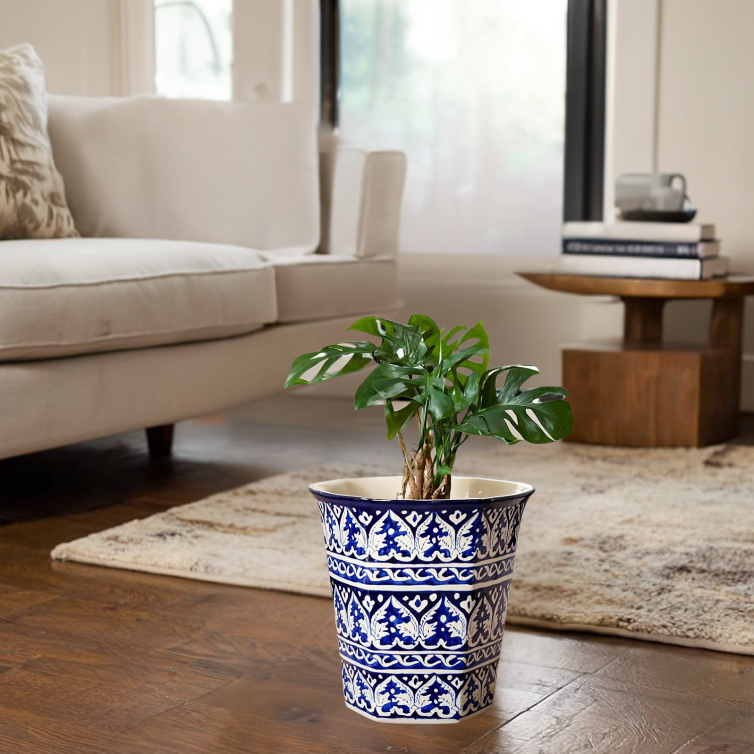 Decorative Multani Blue pottery planter with blue and white pattern on a wooden floor in a living room.
