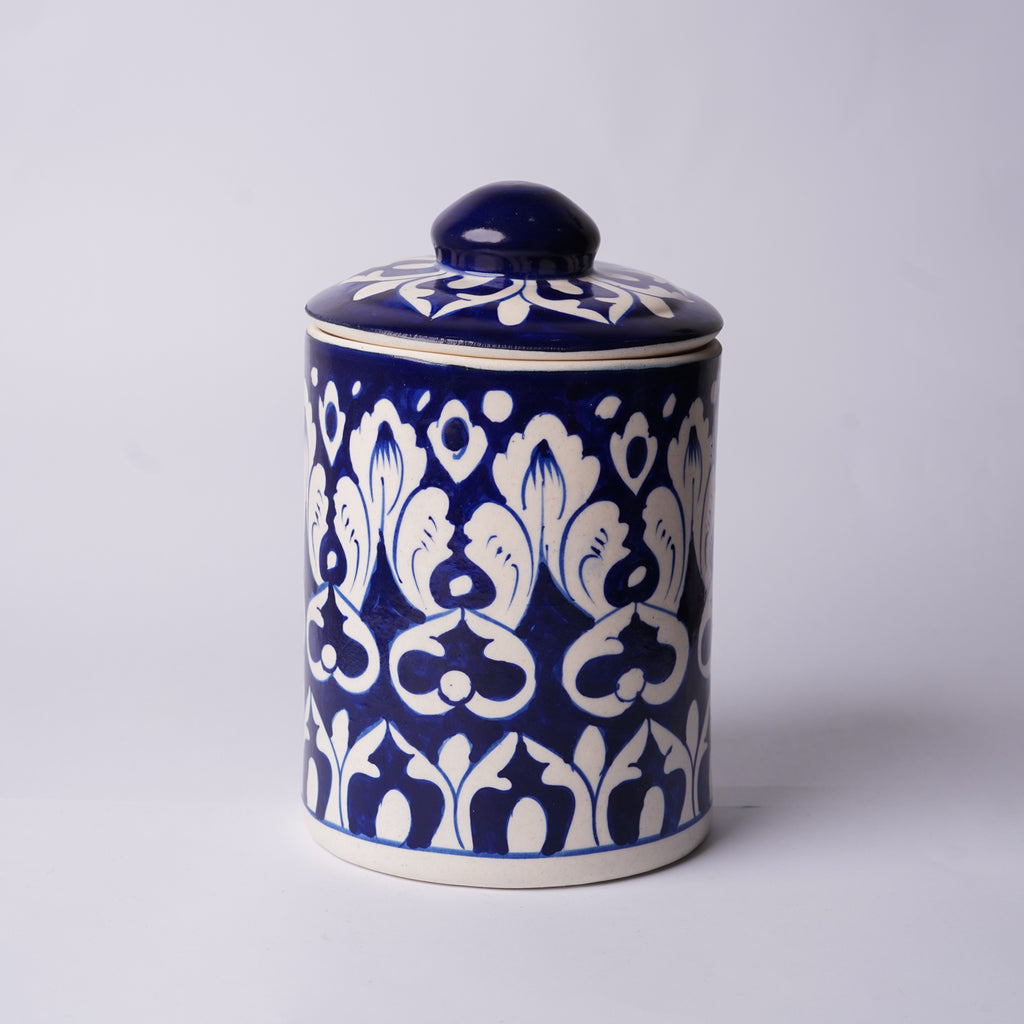 Blue ceramic Multani blue pottery jar with white floral patterns on a light gray background