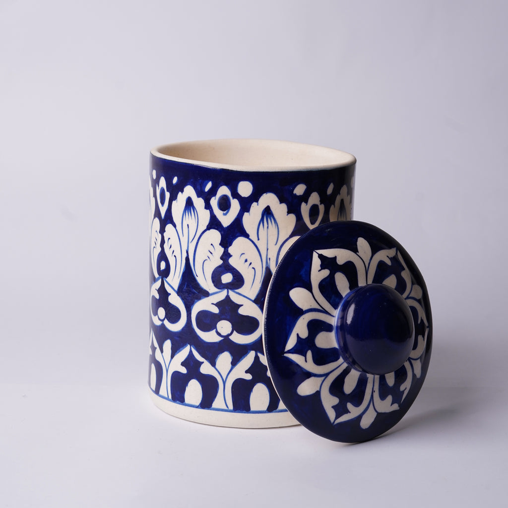 Ceramic Multani blue pottery  jar with blue and white floral pattern on a light gray background