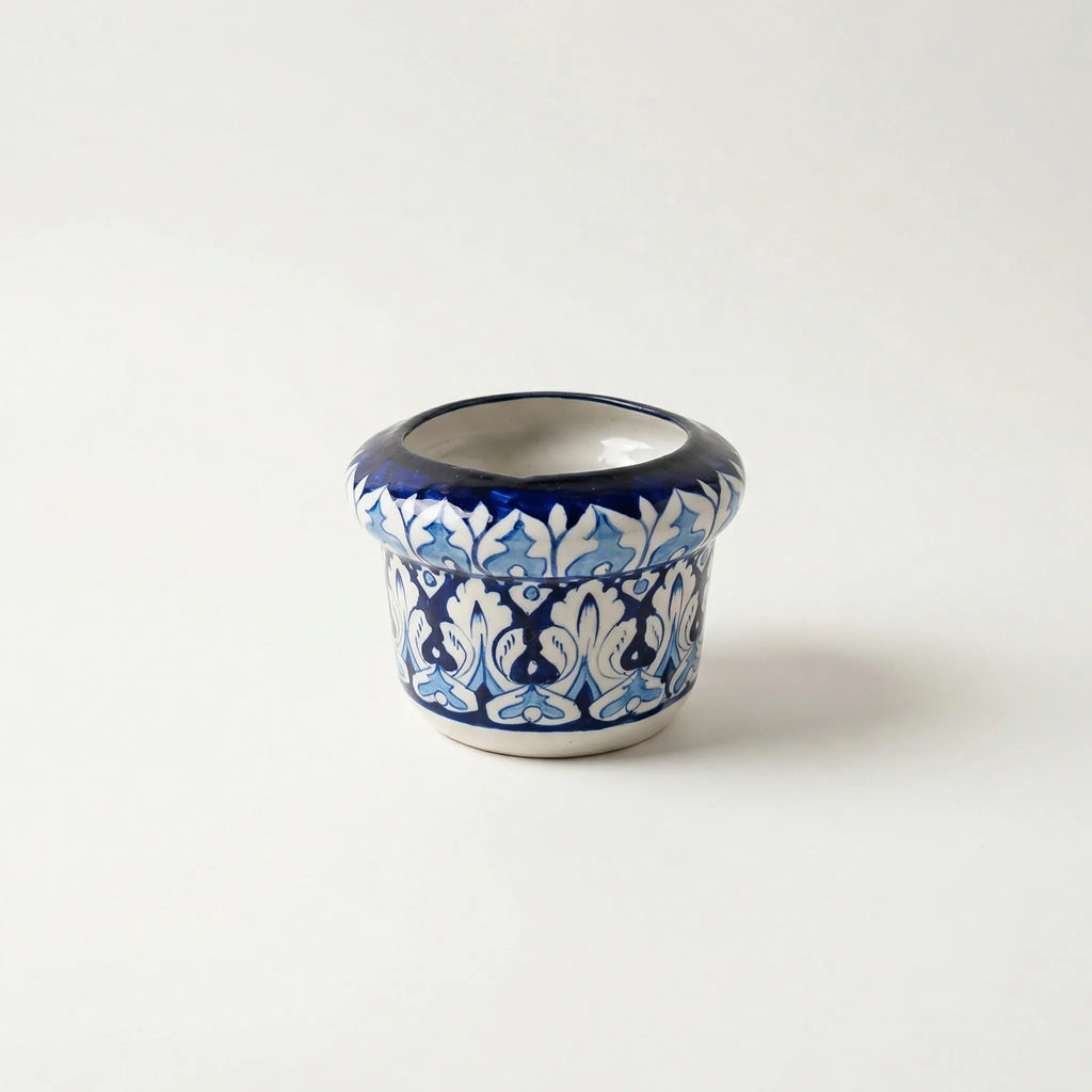 Blue pottery Ceramic pot with blue and white pattern on a white background
