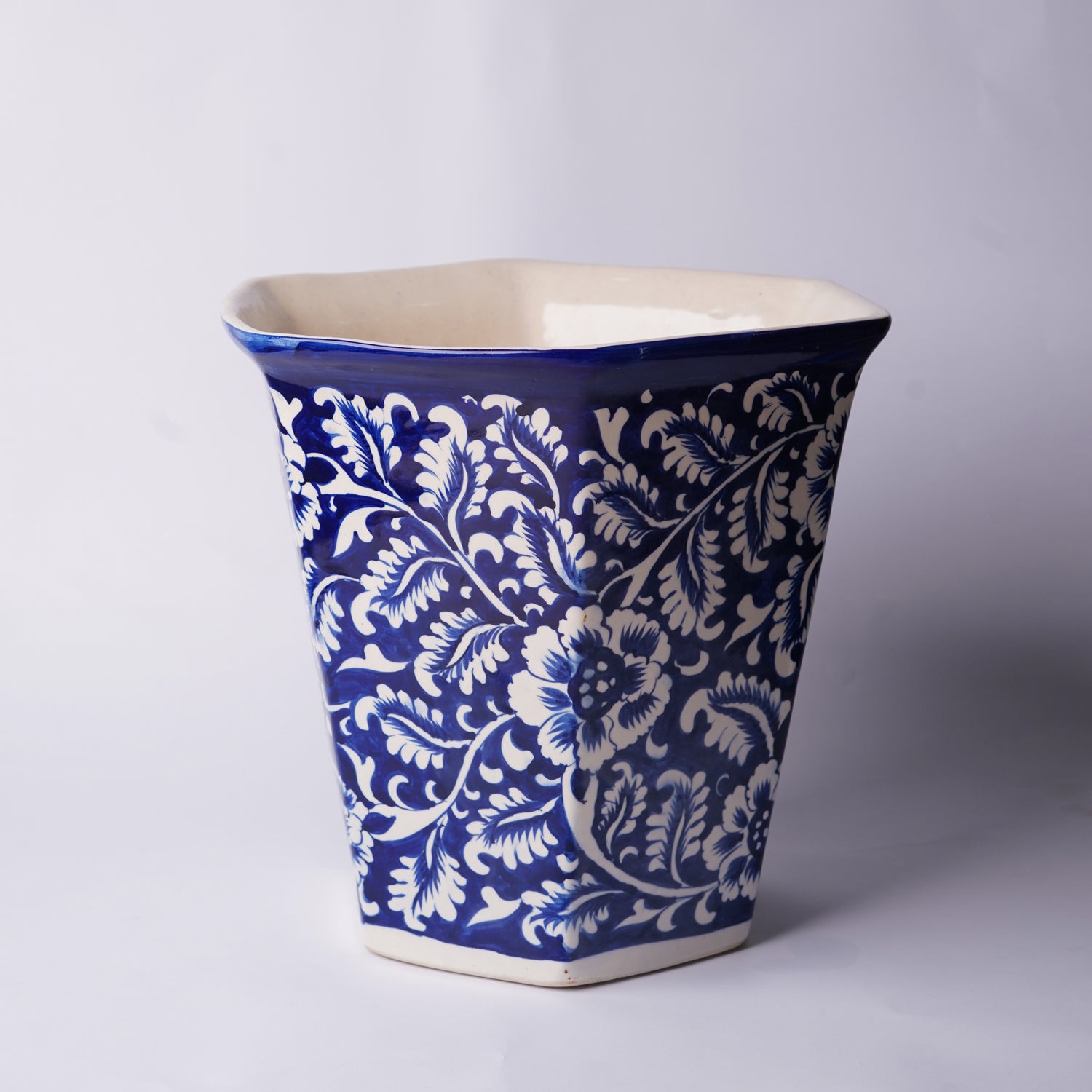 Blue and white patterned ceramic Multani Blue pottery planter on a light gray background