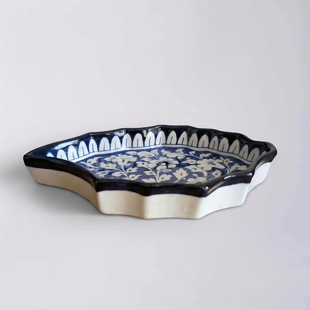 Pakistani ceramic serving dish featuring traditional blue pottery floral motifs