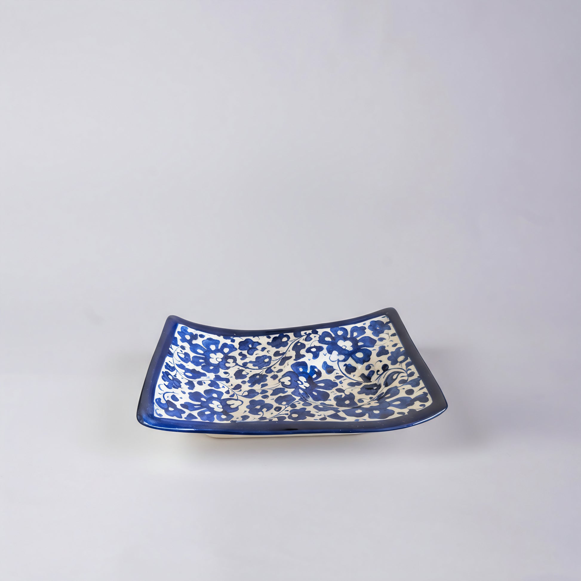 Blue Pottery Wavy Serving Tray — 7″ × 5″ Multani Ceramic (Navy Floral with Cup Crater)