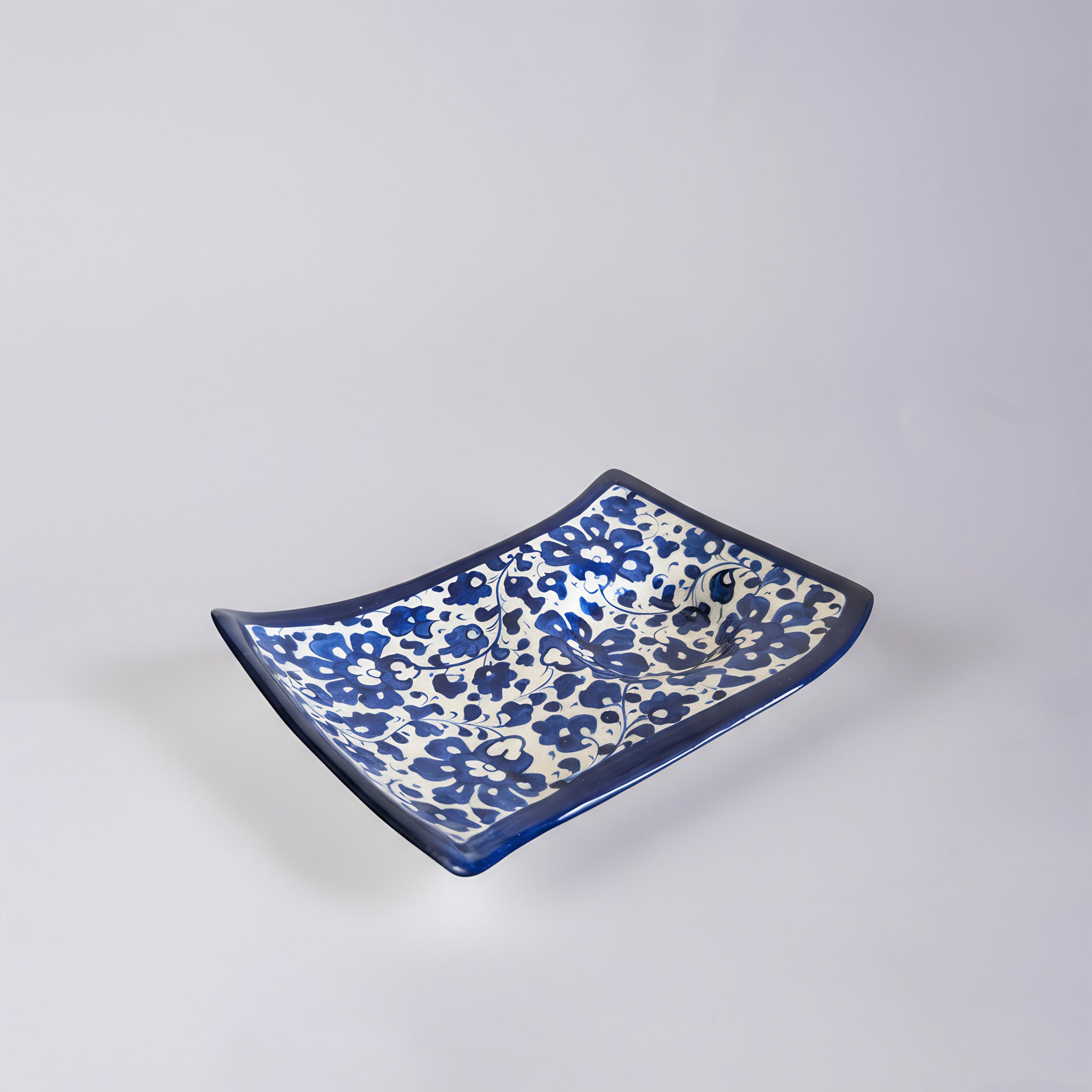 Blue Pottery Wavy Serving Tray — 7″ × 5″ Multani Ceramic (Navy Floral with Cup Crater)
