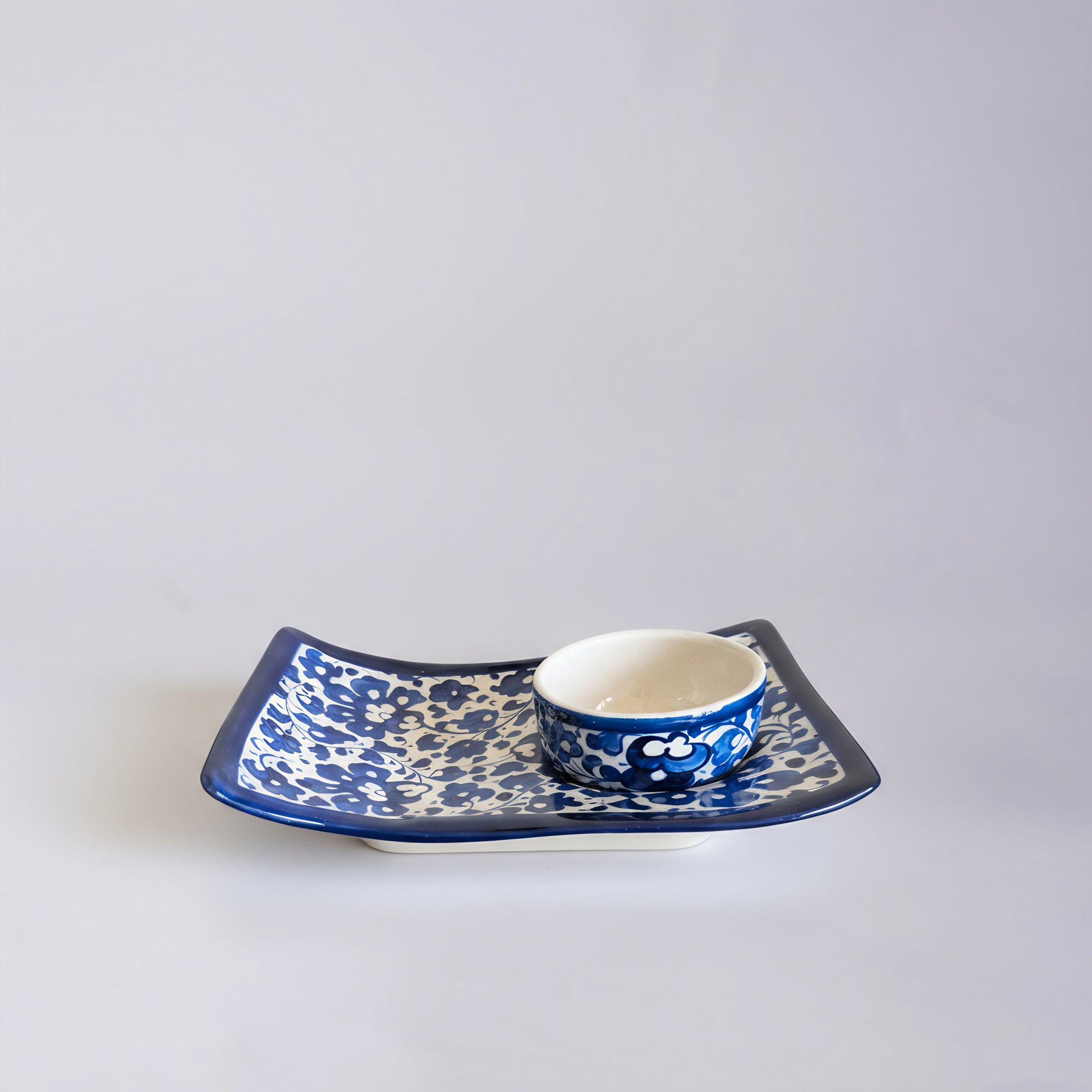 Blue Pottery Wavy Serving Tray — 7″ × 5″ Multani Ceramic (Navy Floral with Cup Crater)