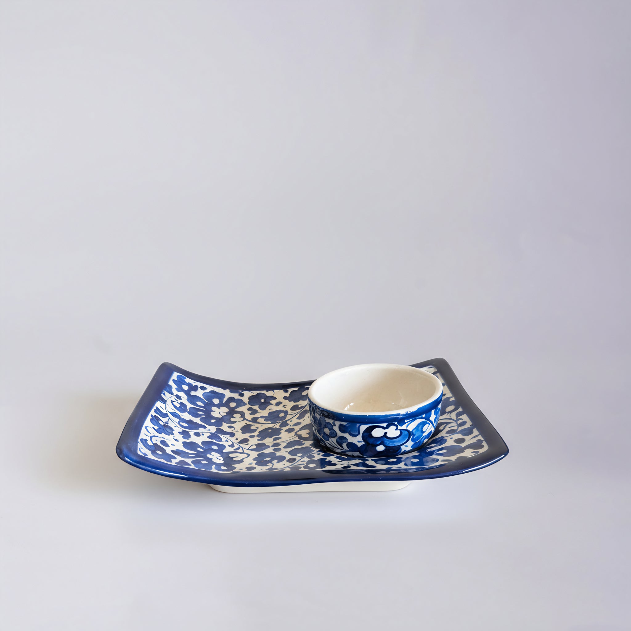 Blue Pottery Wavy Serving Tray — 7″ × 5″ Multani Ceramic (Navy Floral with Cup Crater)