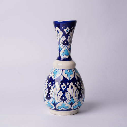 Ceramic multani blue pottery vase with blue and white pattern on a light gray background 