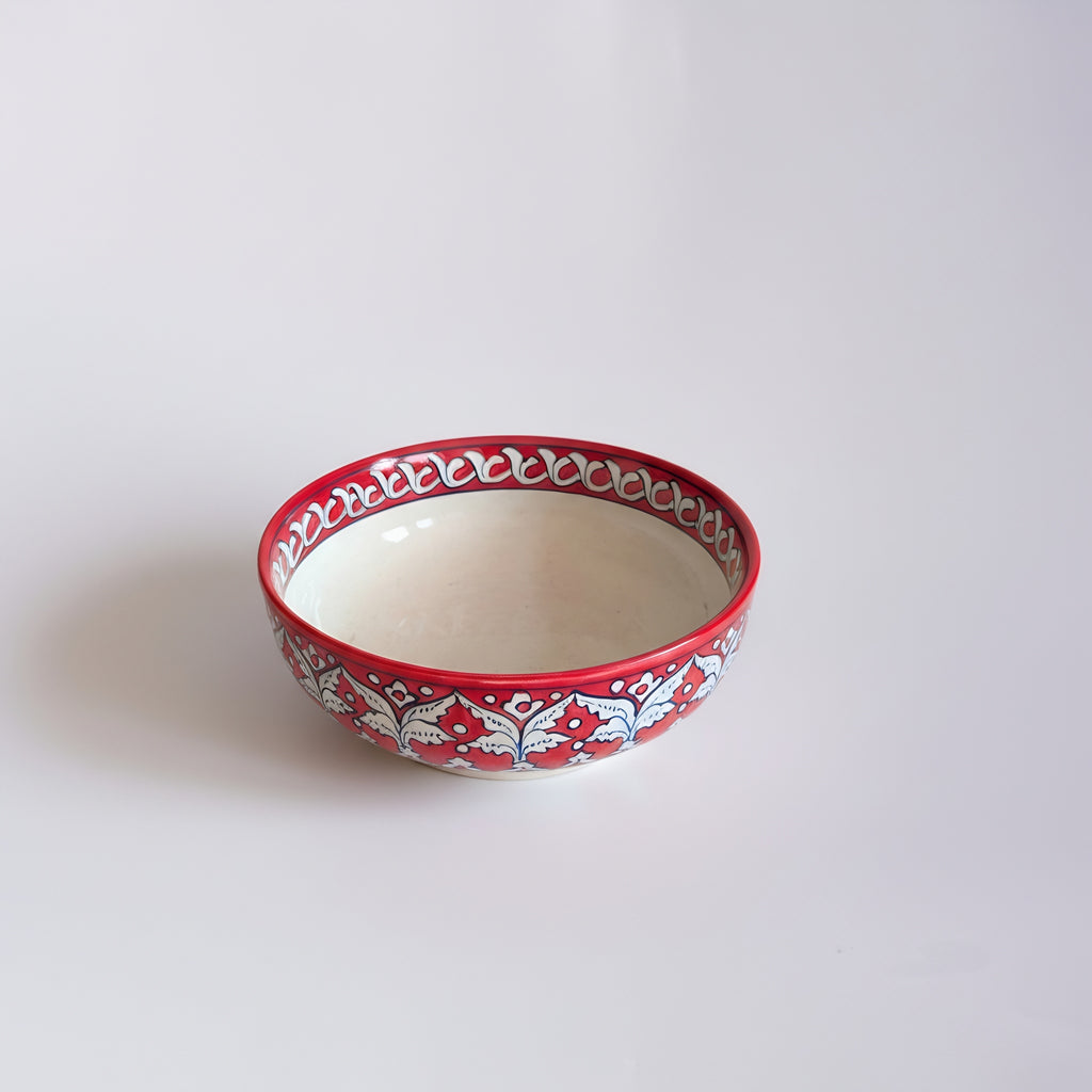 Handcrafted blue pottery bowl collection featuring delicate red flower motifs — Craftan Pakistan