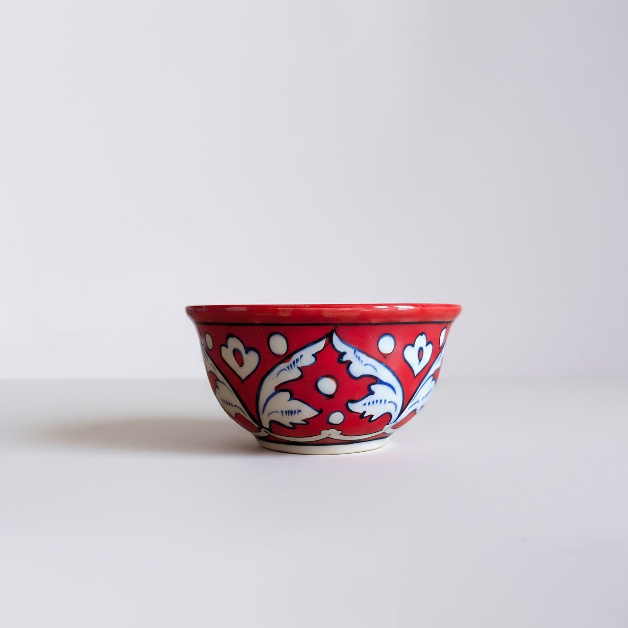 Pakistani artisan blue pottery bowl set showcasing classic red floral artwork — Craftan Pakistan