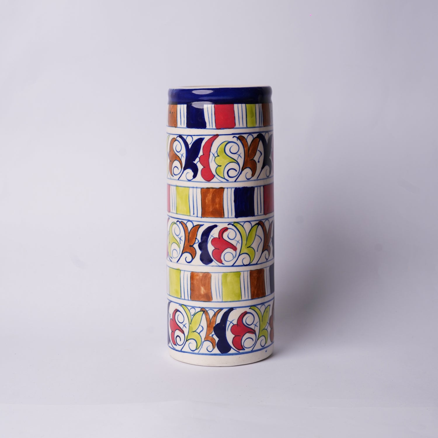 Cylindrical ceramic Multani Blue Pottery  vase with colorful geometric pattern on a white background