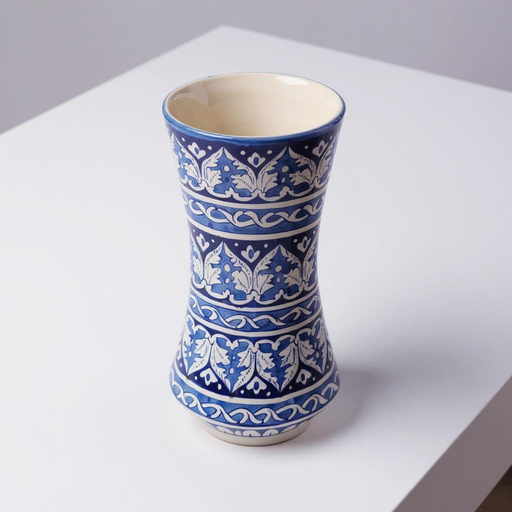 Ceramic Multani blue pottery vase with blue and white pattern on a white surface