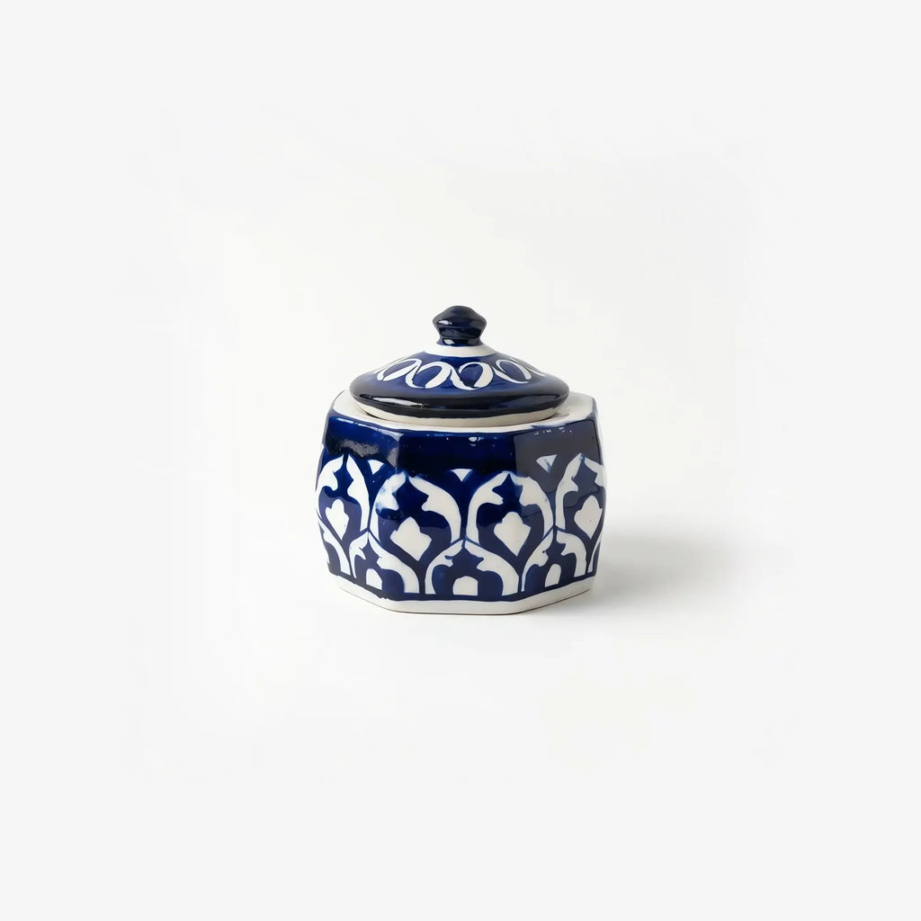 Blue pottery jewelry box with domed lid closed, front view