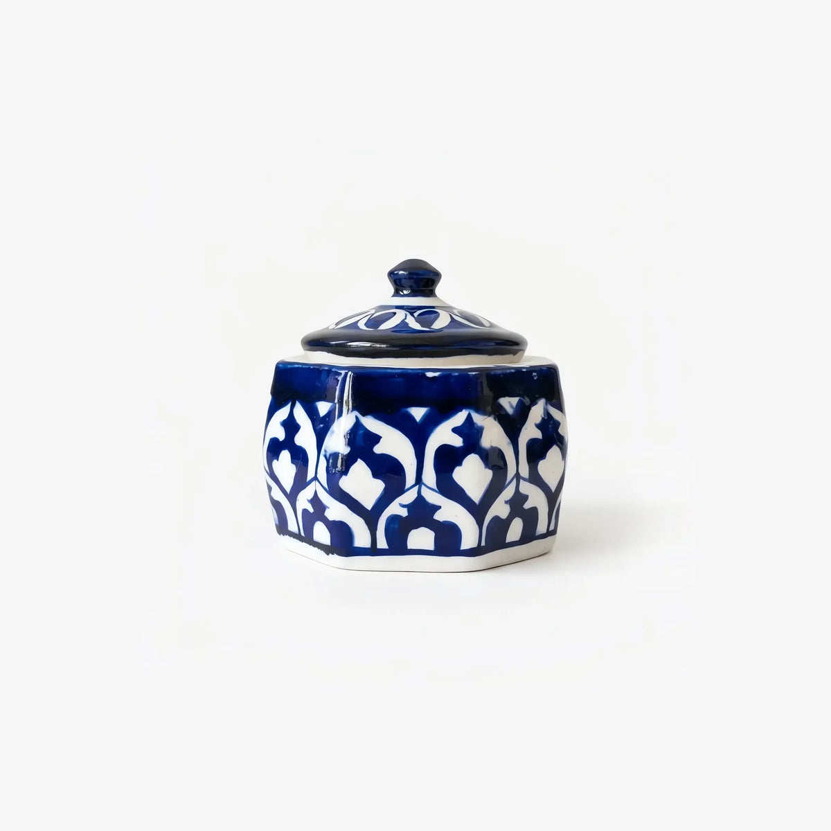 Cobalt and white octagonal ceramic jewelry box with knob lid, side view