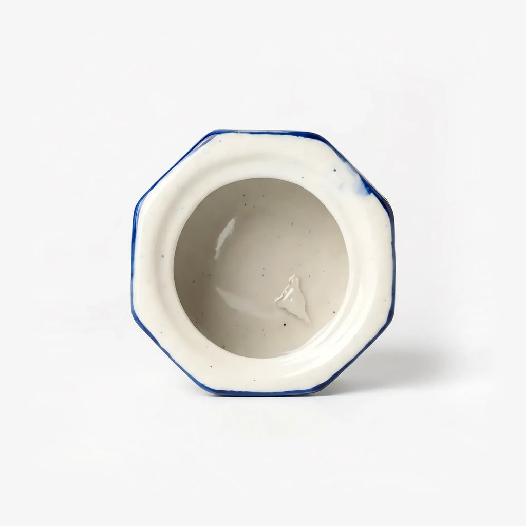 Cream glazed interior of the octagonal blue pottery jewelry box