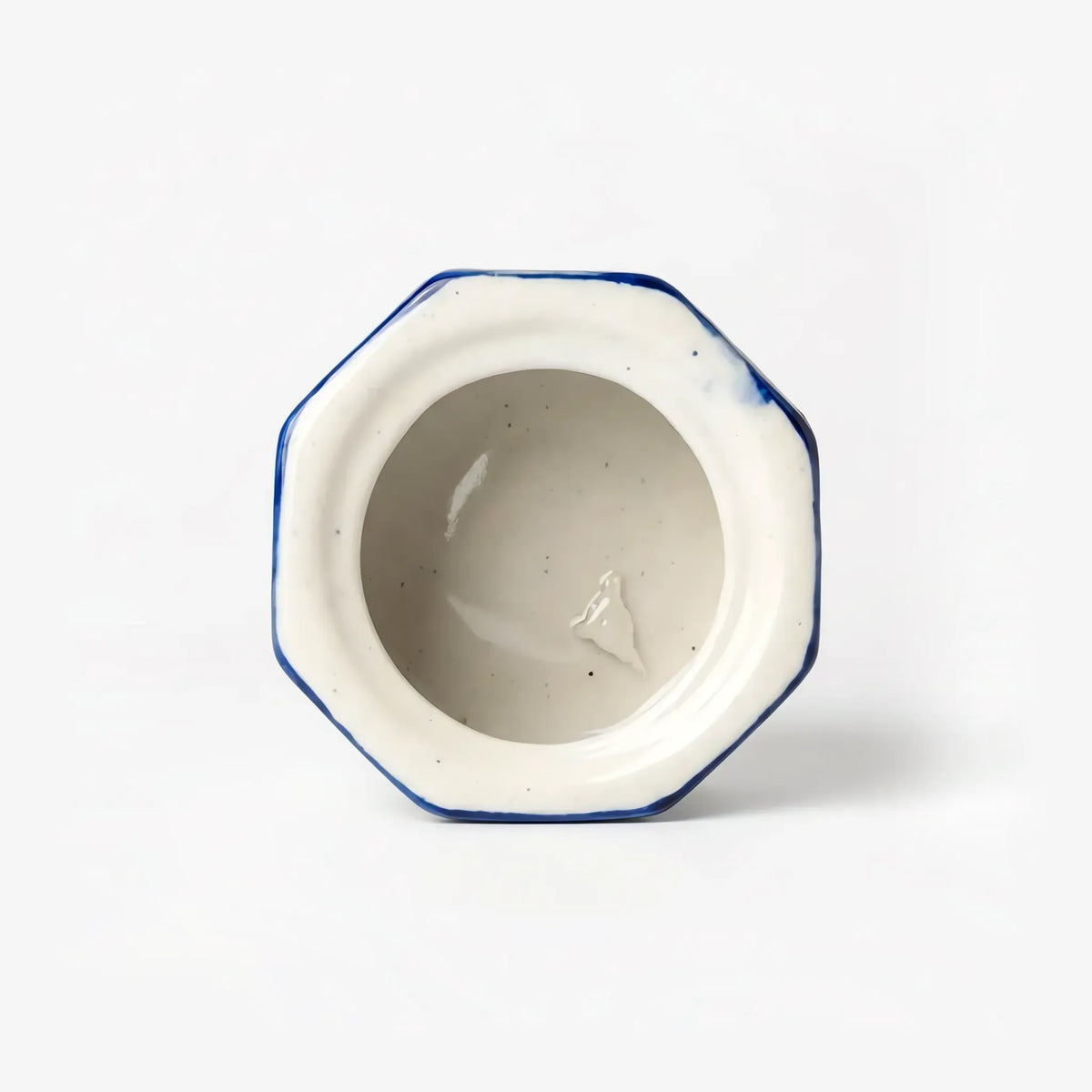 Cream glazed interior of the octagonal blue pottery jewelry box