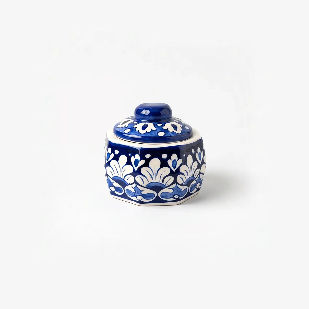 Blue pottery jewelry box with domed lid closed, white palmettes on cobalt