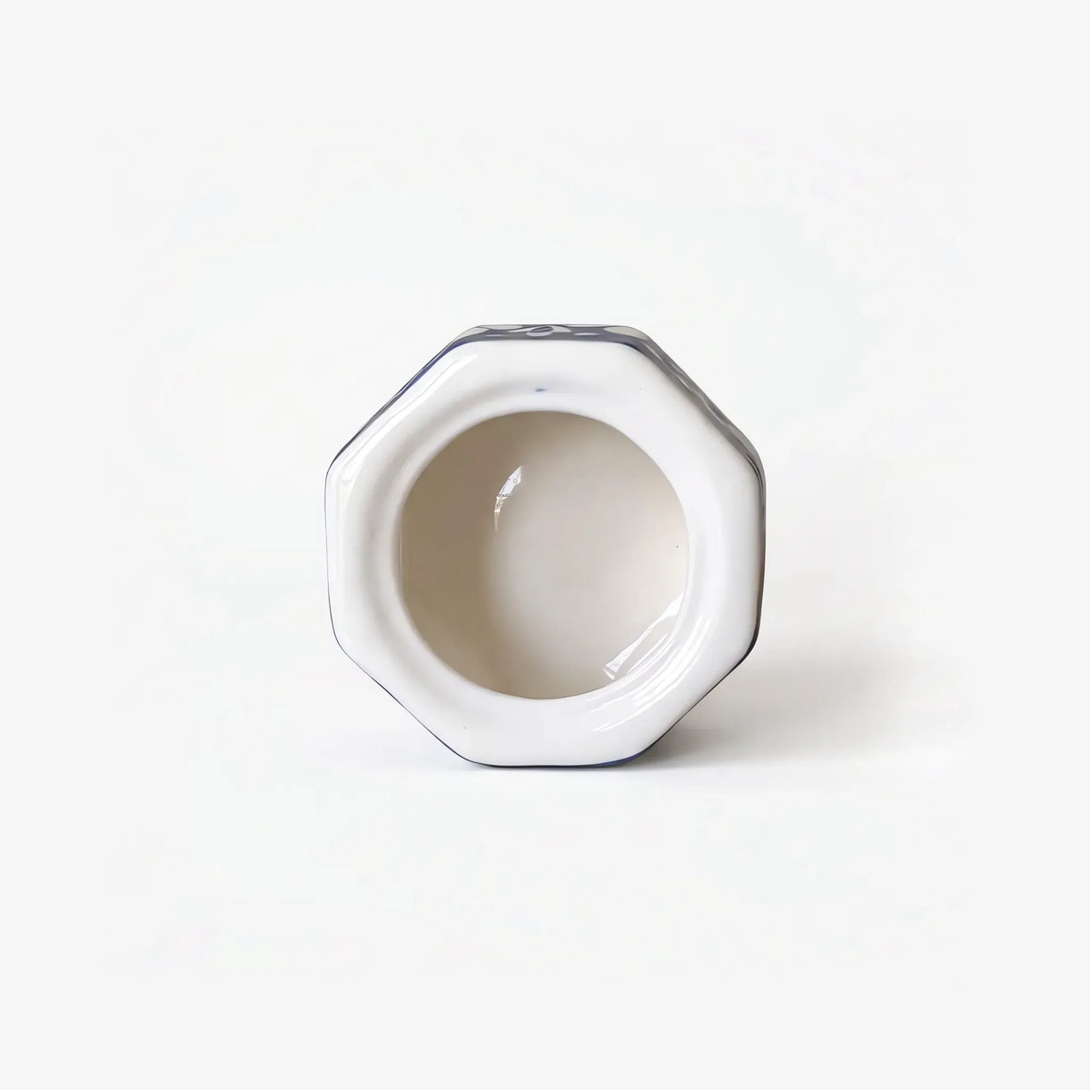 Cream glazed interior of the octagonal blue pottery jewelry box