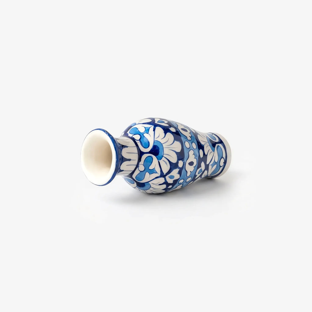 7 inch blue pottery mini vase lying on its side showing the flared mouth