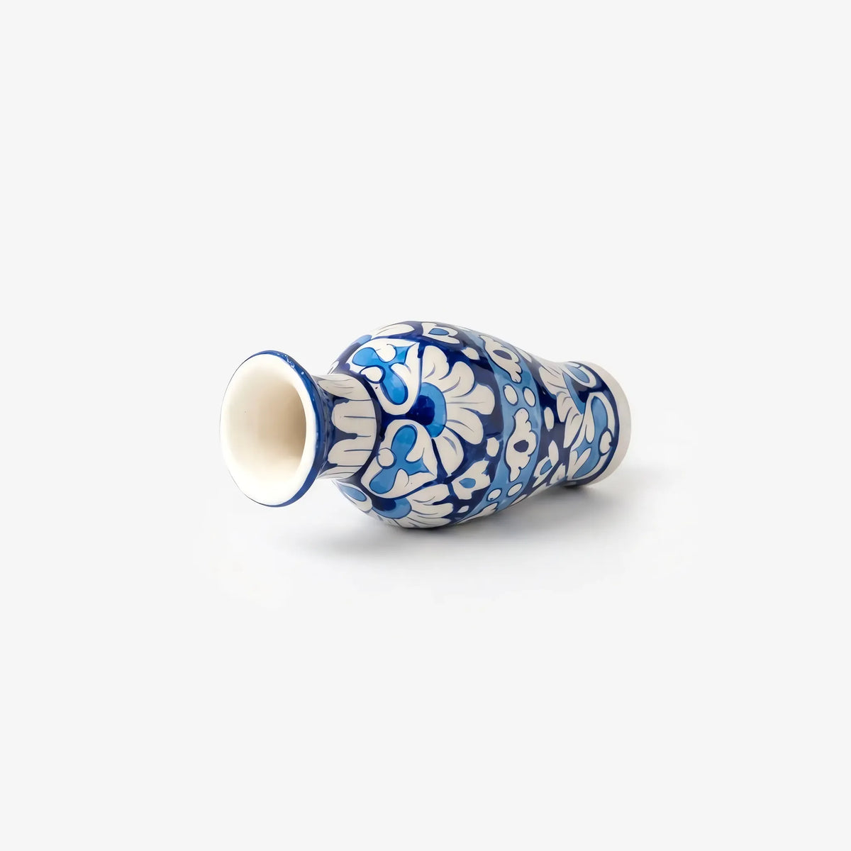 7 inch blue pottery mini vase lying on its side showing the flared mouth