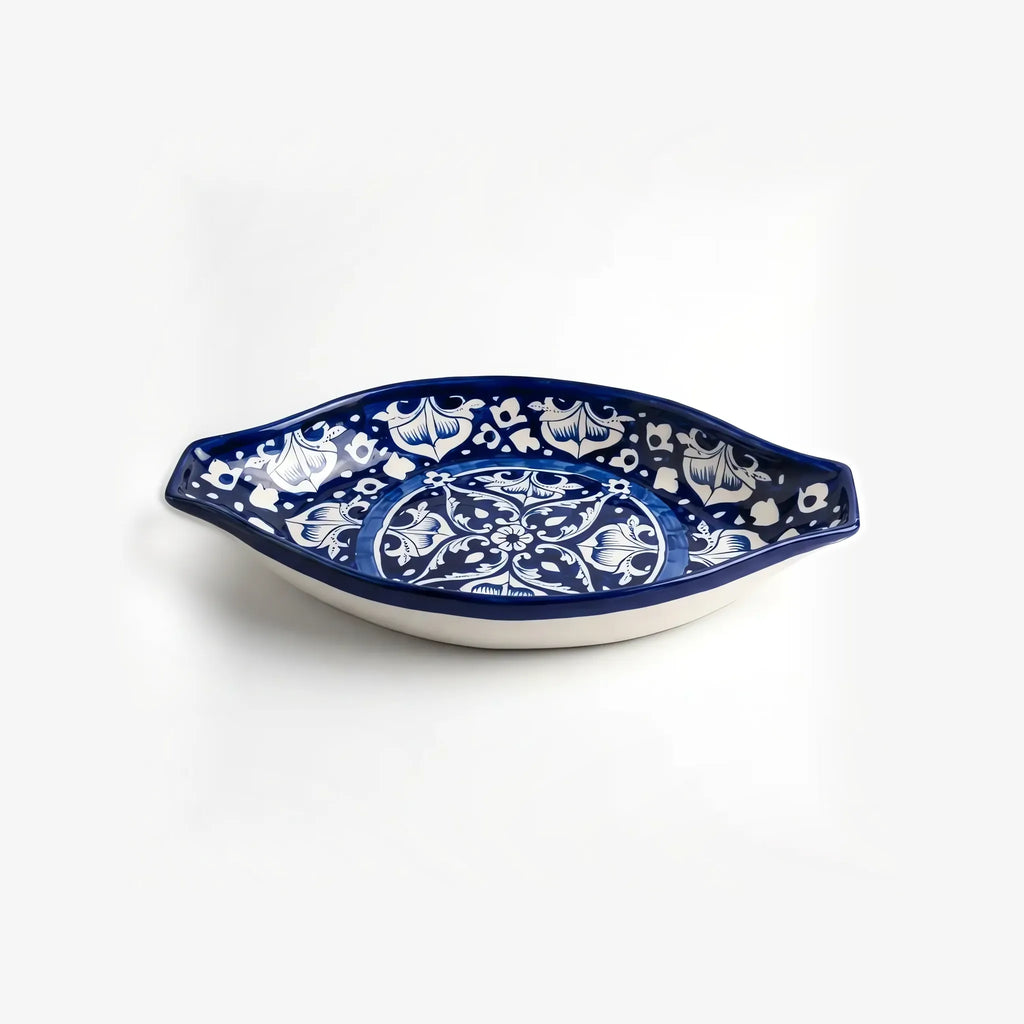 Oval rice dish with pointed end handles, side view