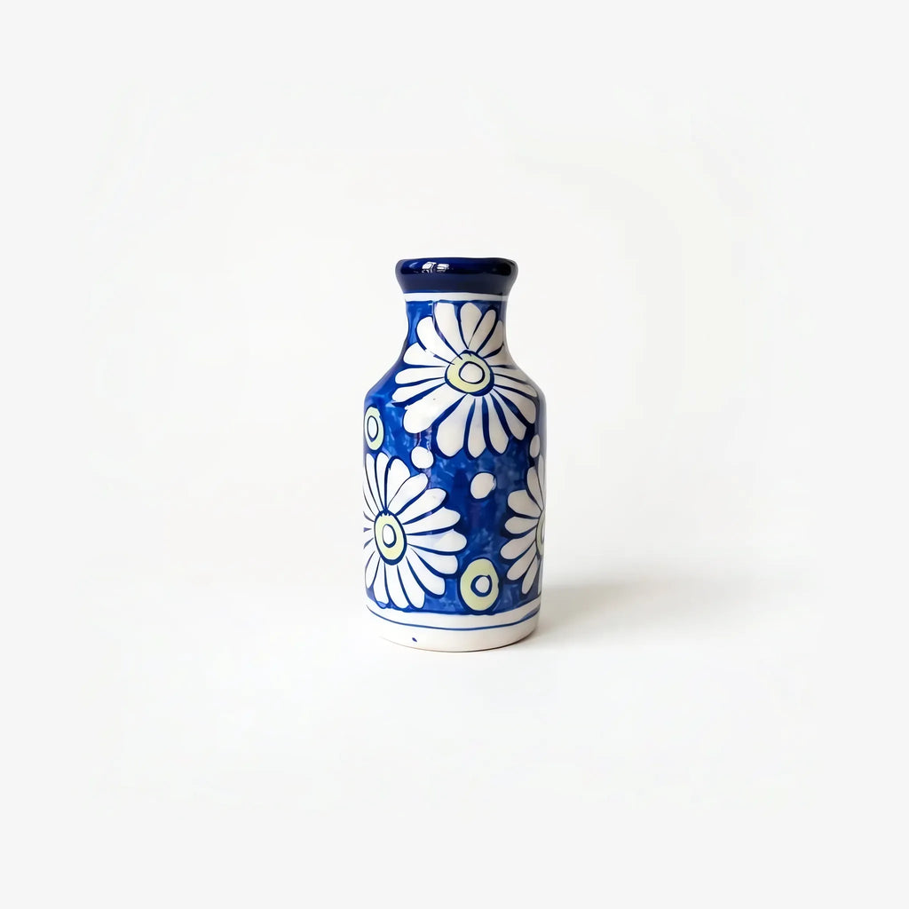 6 inch blue pottery bottle vase with big white daisies on cobalt