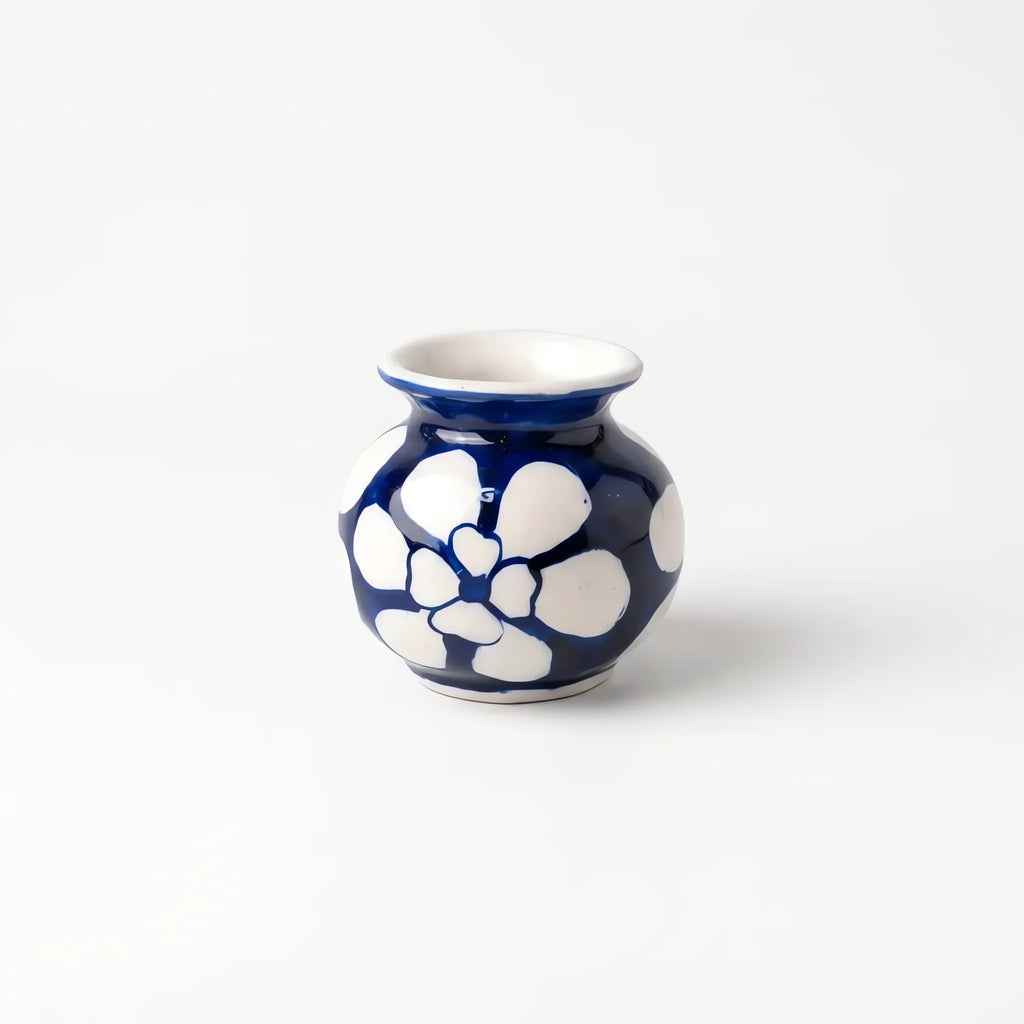 3 inch blue pottery garwi with big white flowers on cobalt