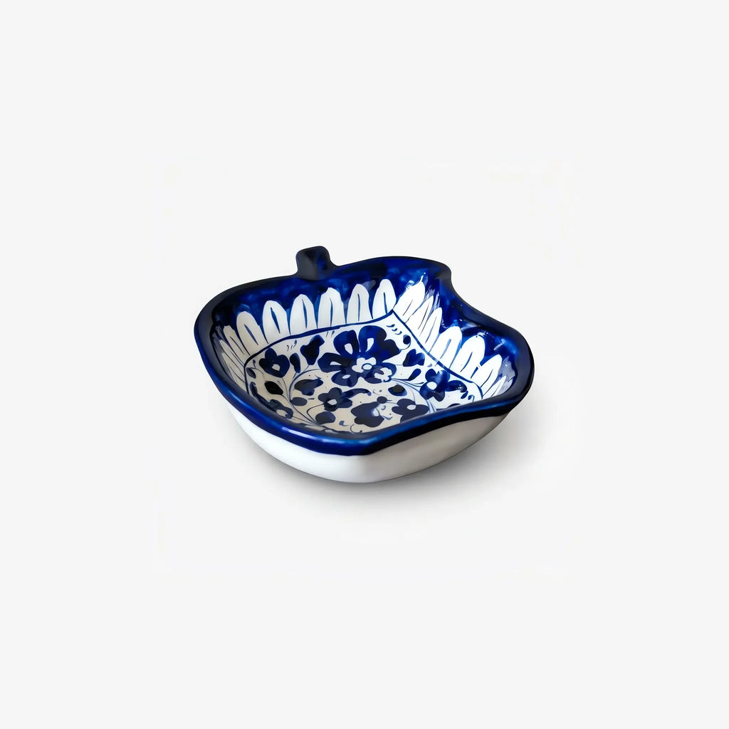 Angled view of the blue pottery apple bowl