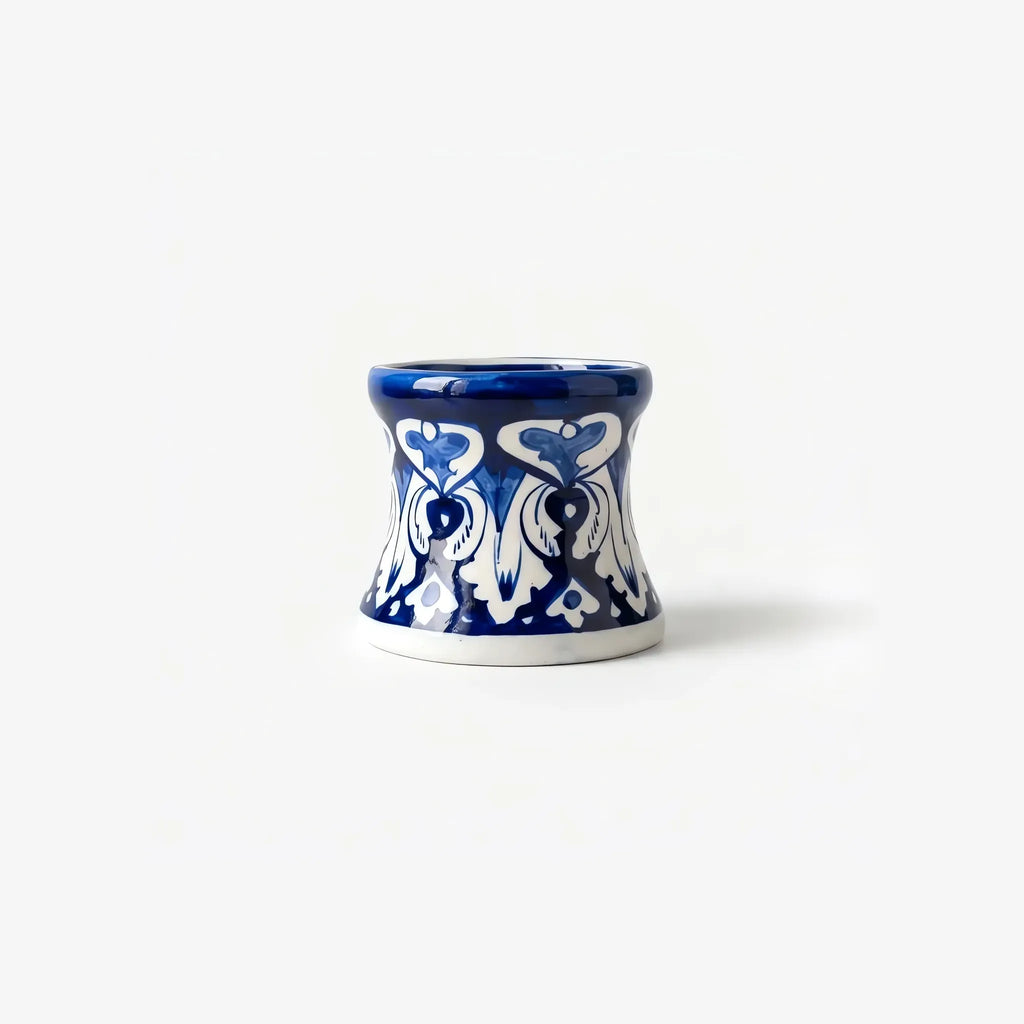 Side view of the hourglass blue pottery candle stand