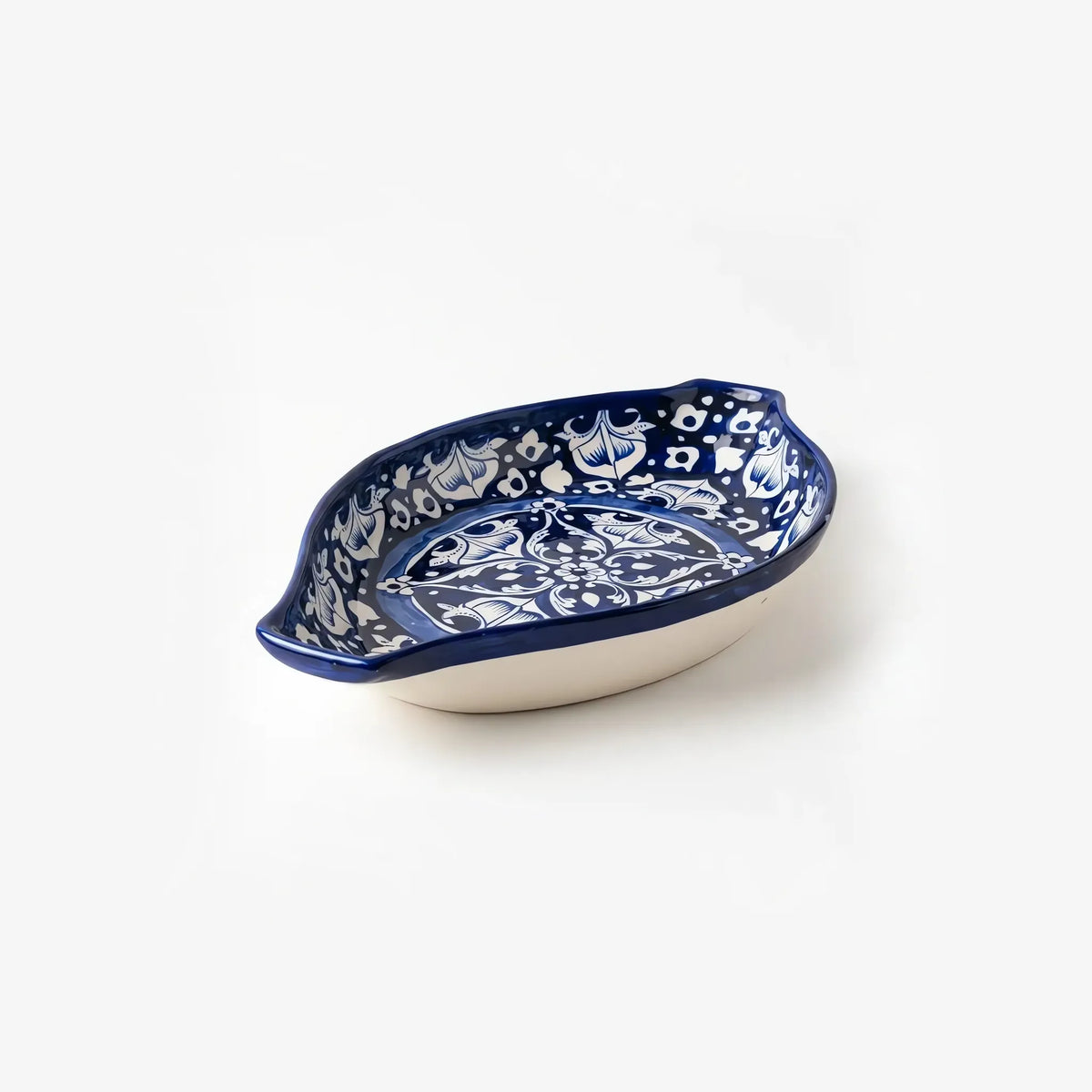 Blue pottery oval rice dish showing its depth