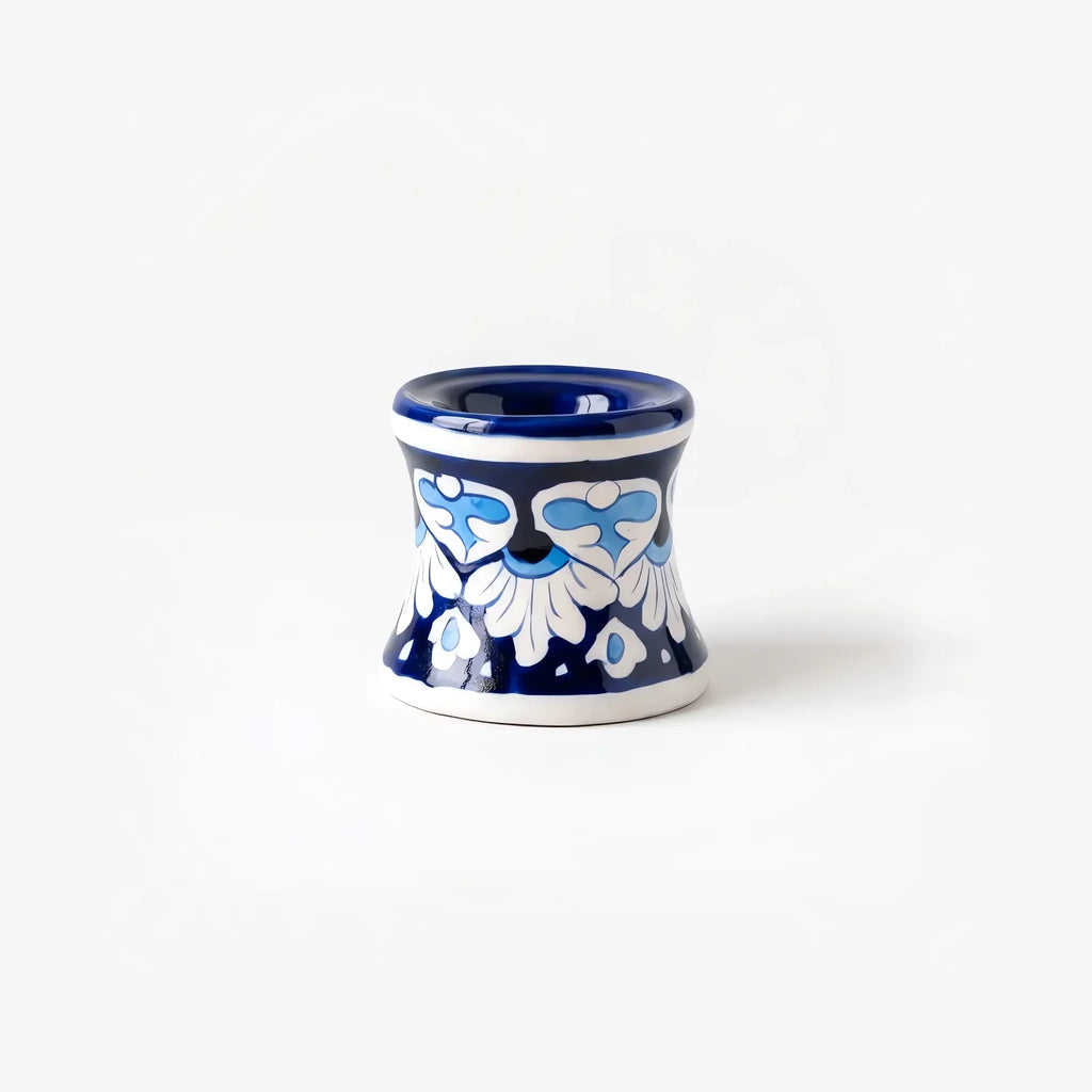 Hourglass blue pottery candle stand with white palmettes, front view