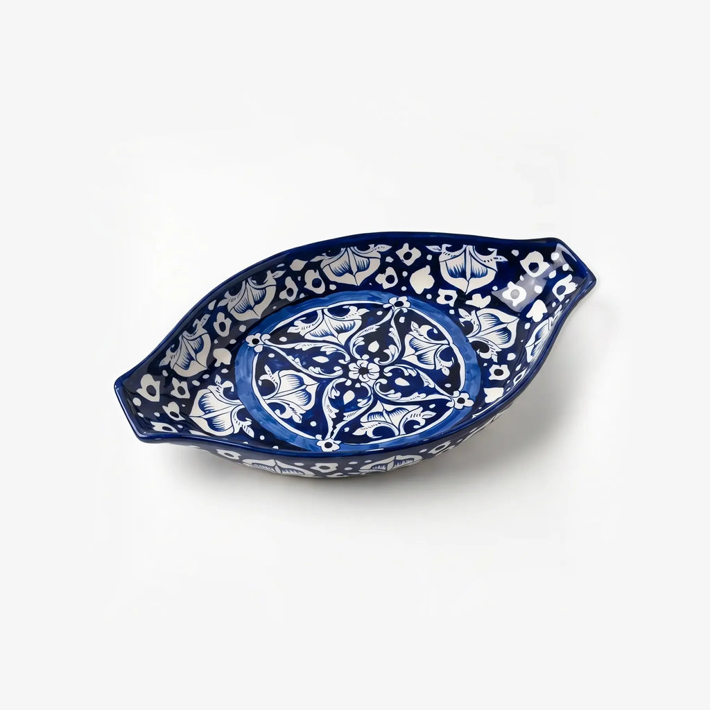 Large oval blue pottery rice dish with cobalt medallion design