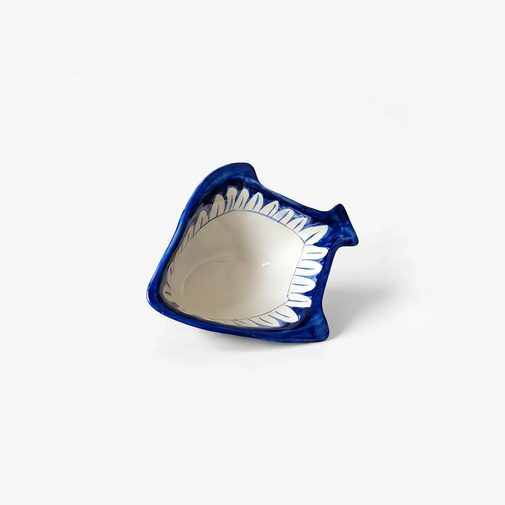 Fish-shaped blue pottery bowl seen from above
