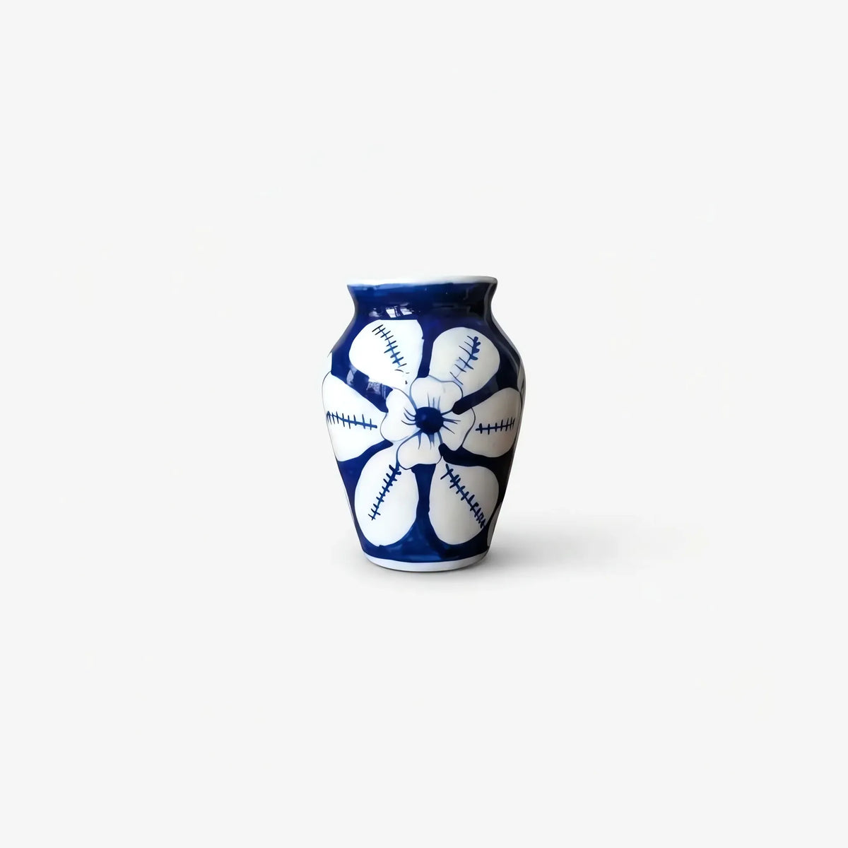 Mini vase showing the stitch-edged white petals