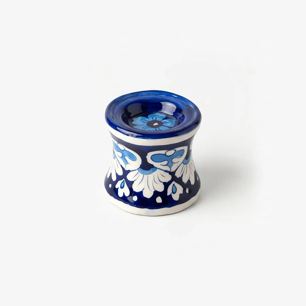 3 inch blue pottery candle stand with sky-blue flower in the top cup