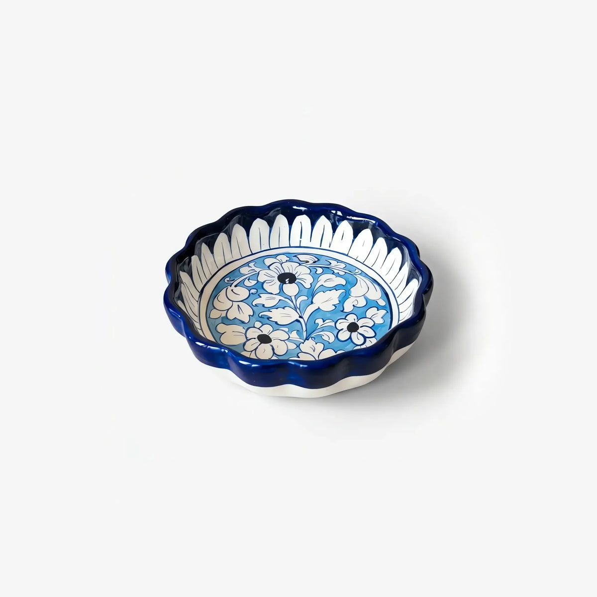 Blue pottery pie dish with white petal border and sky-blue centre