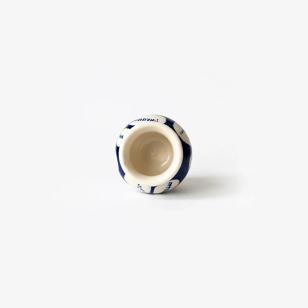 Top view into the white flower mini vase