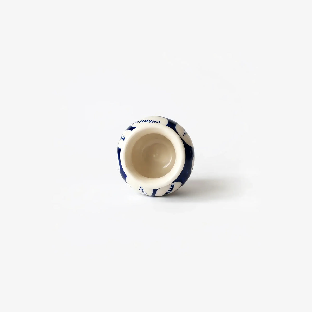 Top view into the white flower mini vase