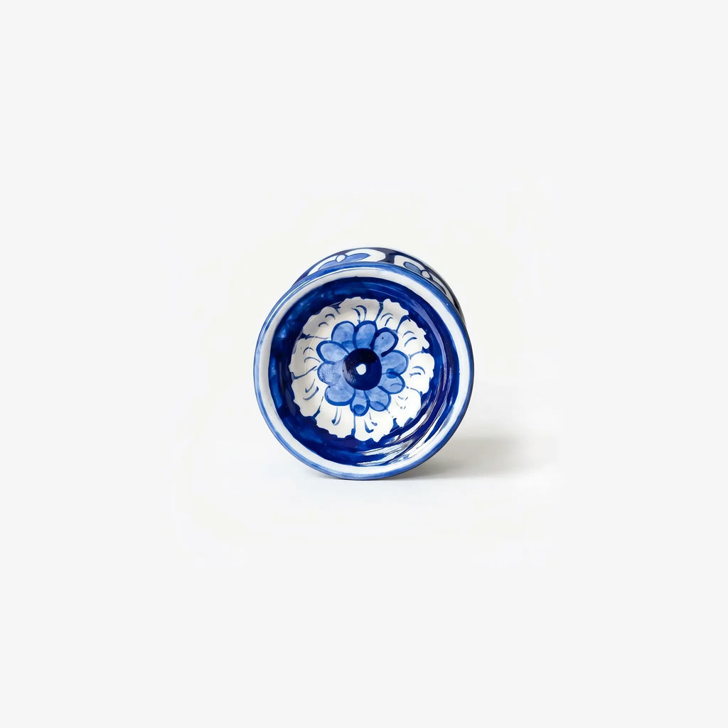 Top view of the blue pottery candle stand cup with a blue flower