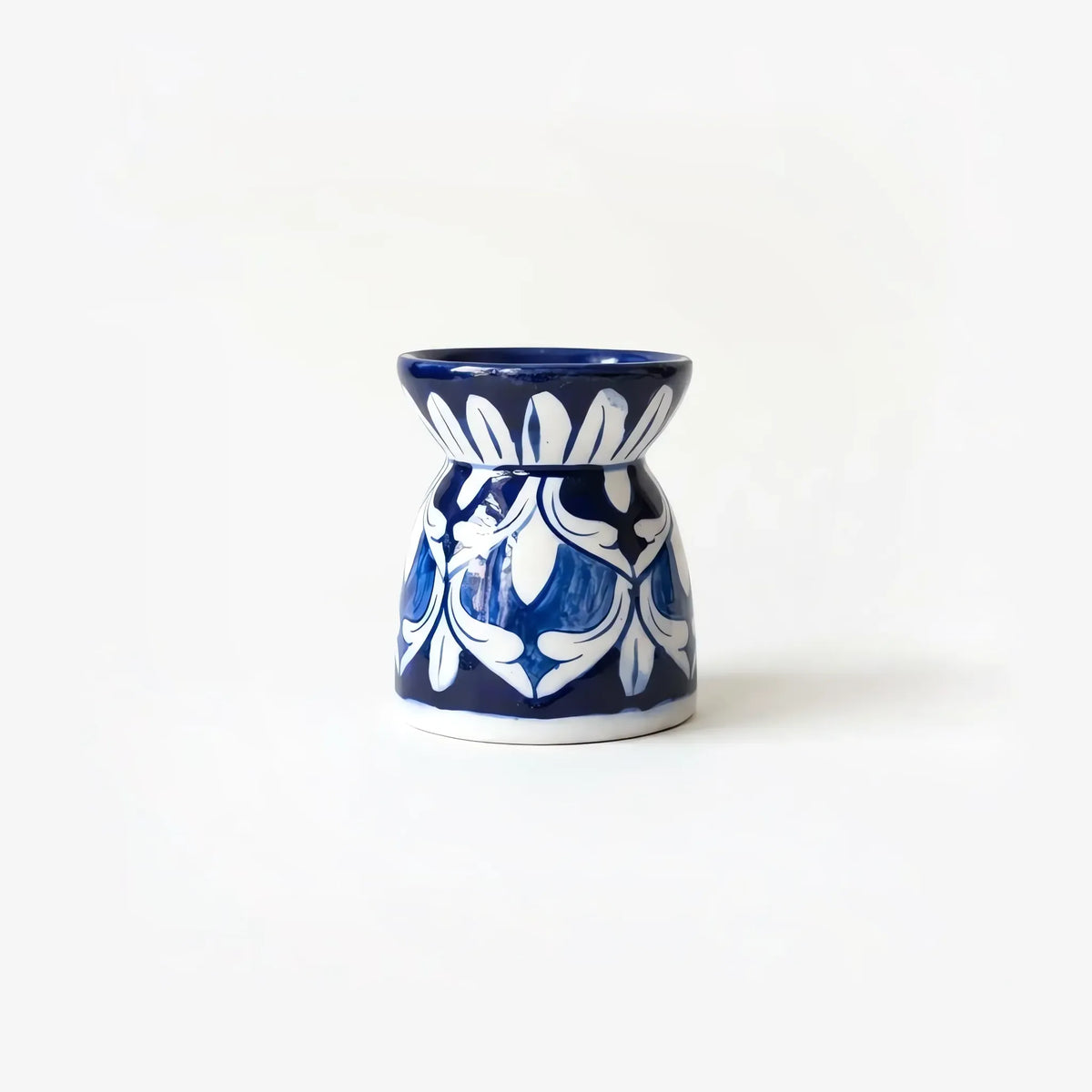 4 inch blue pottery oil burner with white arabesque on cobalt
