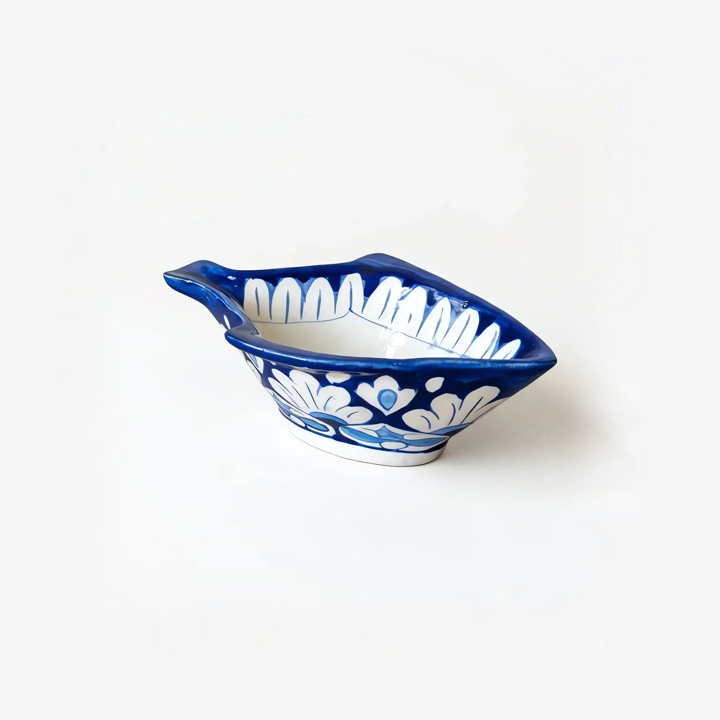 Side view of the fish bowl showing white flowers on the outside