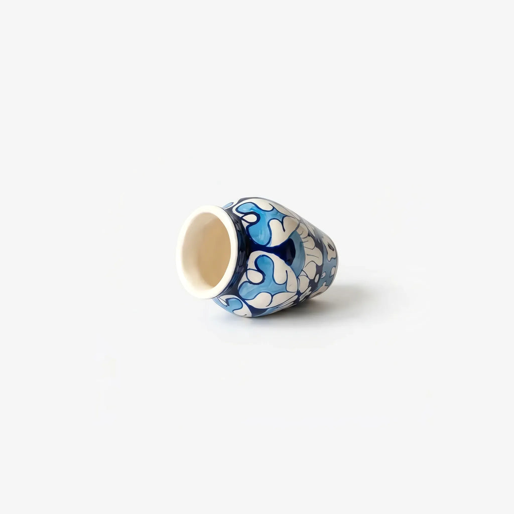 Mini vase lying on its side showing the mouth